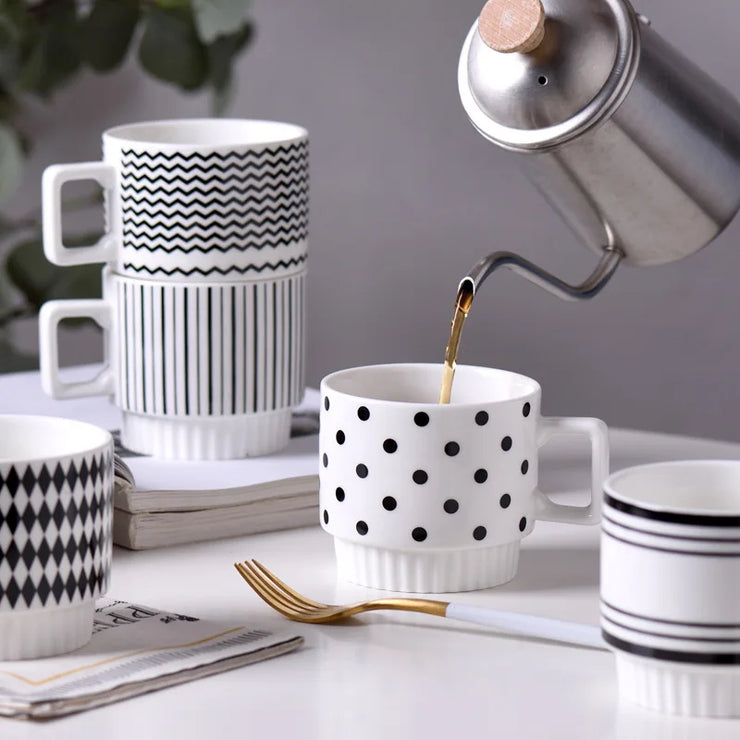 Nordic-style ceramic mug (1 unit), with various graphic prints. Stackable.