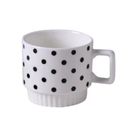 Nordic-style ceramic mug (1 unit), with various graphic prints. Stackable.