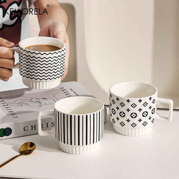 Nordic-style ceramic mug (1 unit), with various graphic prints. Stackable.