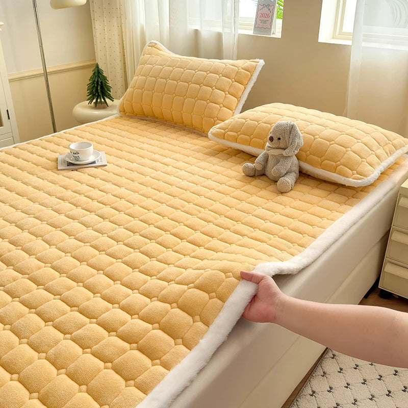 Yellow quilted fleece bedding with white trim and matching pillowcases.