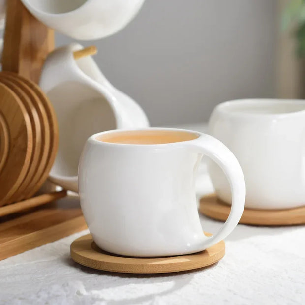 Set of Ceramic Cups and Saucers with Bamboo Tray – 4 to 6 Pieces, Elegant and Heat Resistant Design.