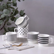 Nordic-style ceramic mug (1 unit), with various graphic prints. Stackable.