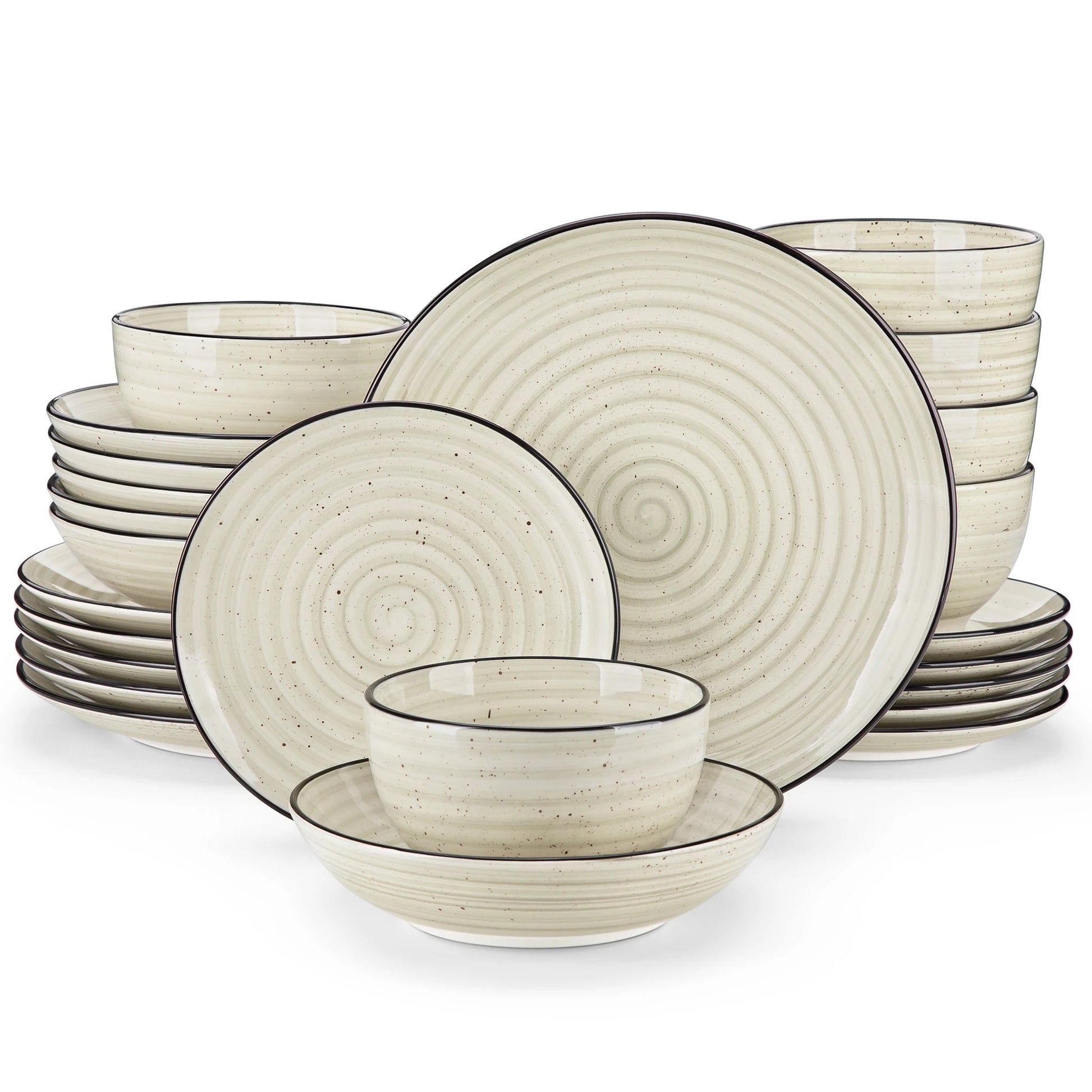 Set of ceramic dinnerware with spiral design on a white background