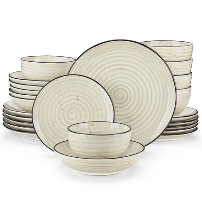 Set of ceramic dinnerware with spiral design on a white background