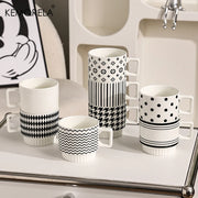 Nordic-style ceramic mug (1 unit), with various graphic prints. Stackable.
