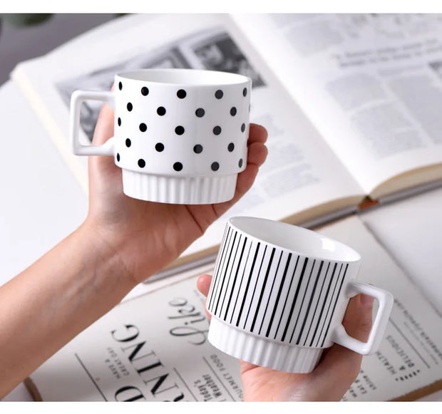 Nordic-style ceramic mug (1 unit), with various graphic prints. Stackable.