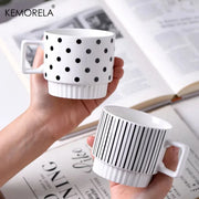 Nordic-style ceramic mug (1 unit), with various graphic prints. Stackable.